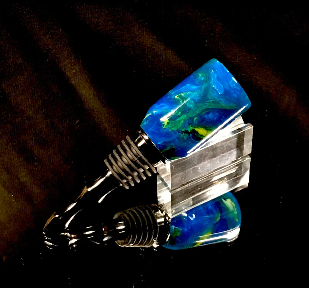 Blue acrylic bottle stopper.