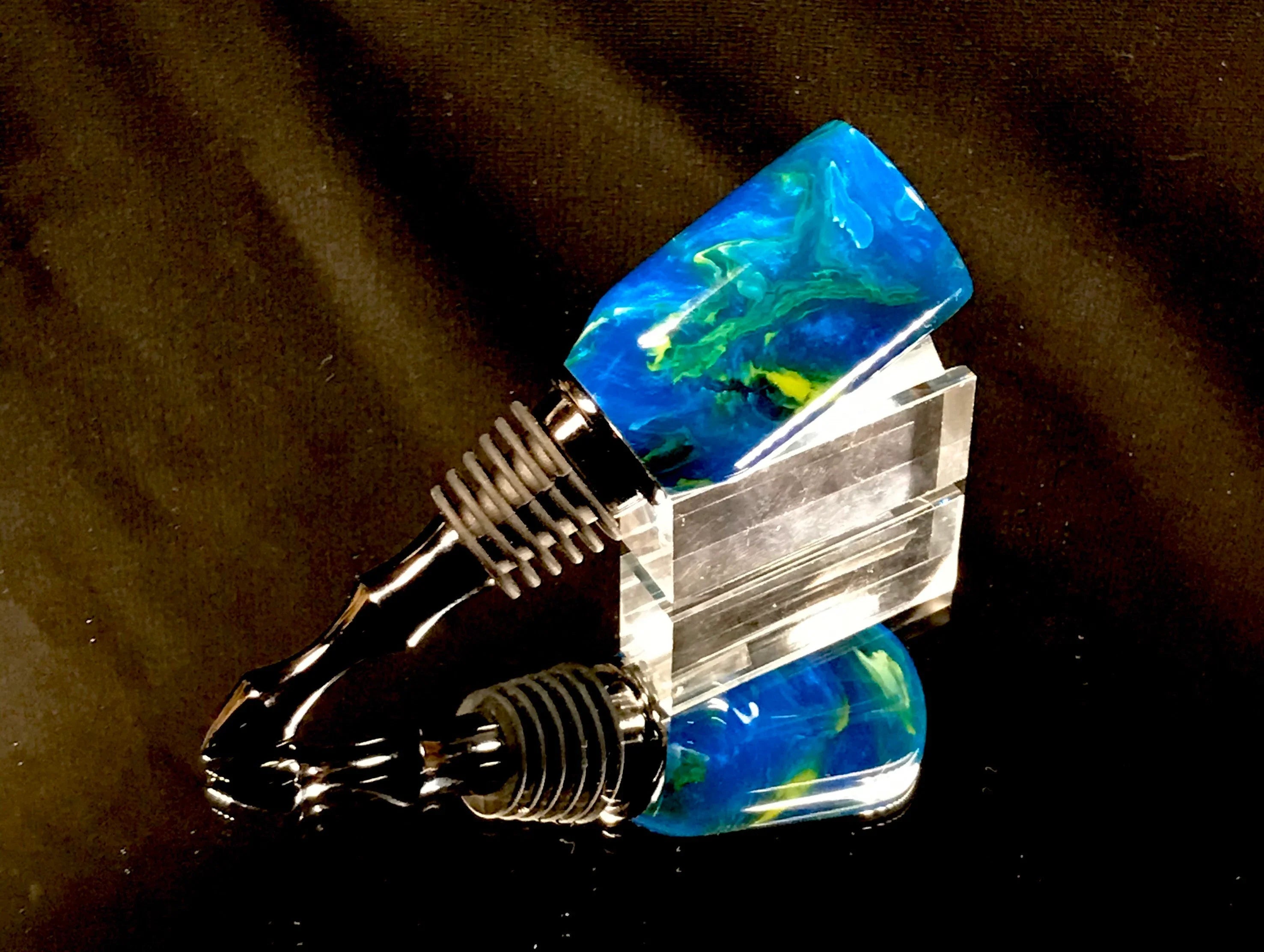 Blue acrylic bottle stopper.
