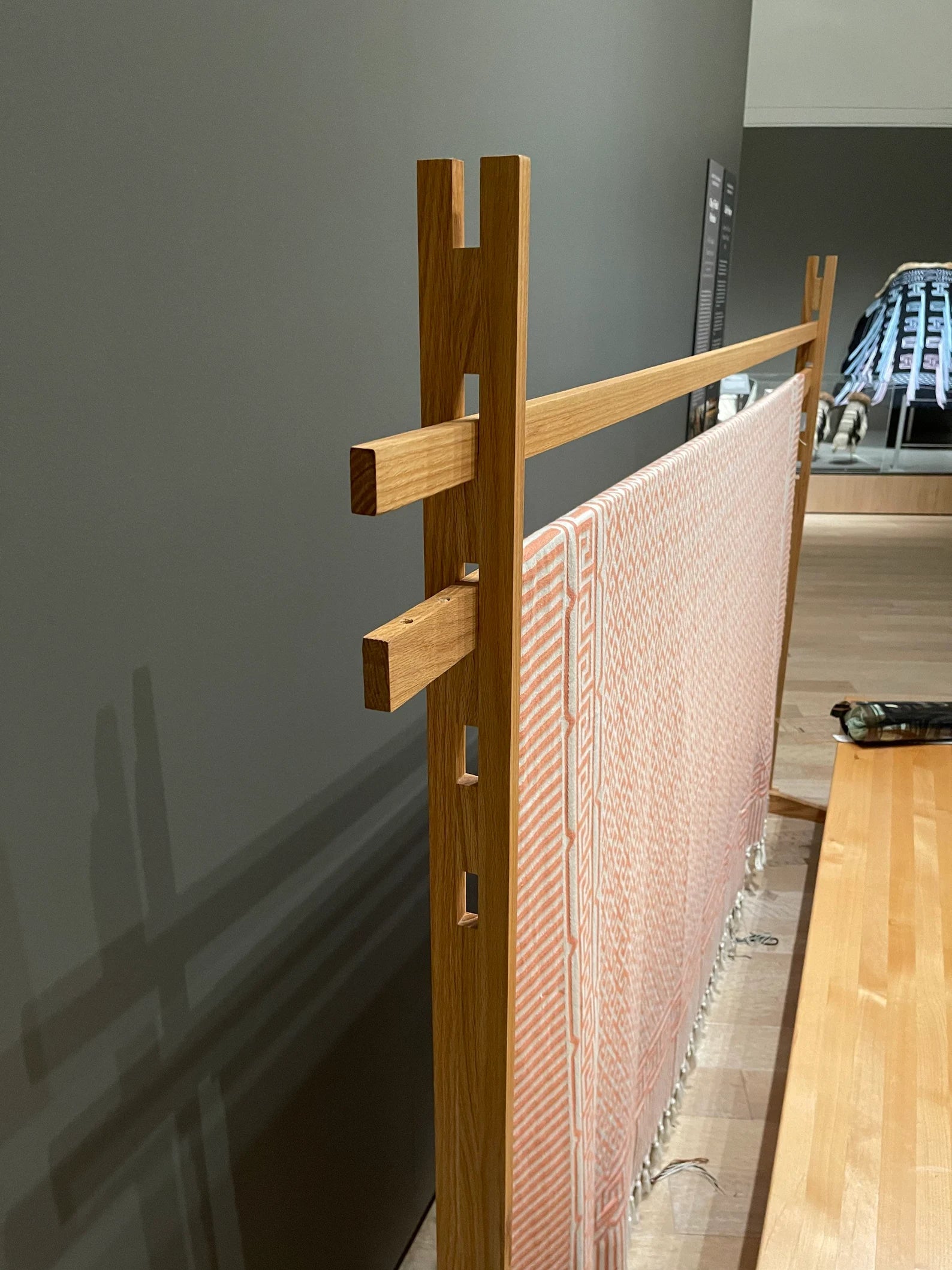 A large wooden weaving loom.