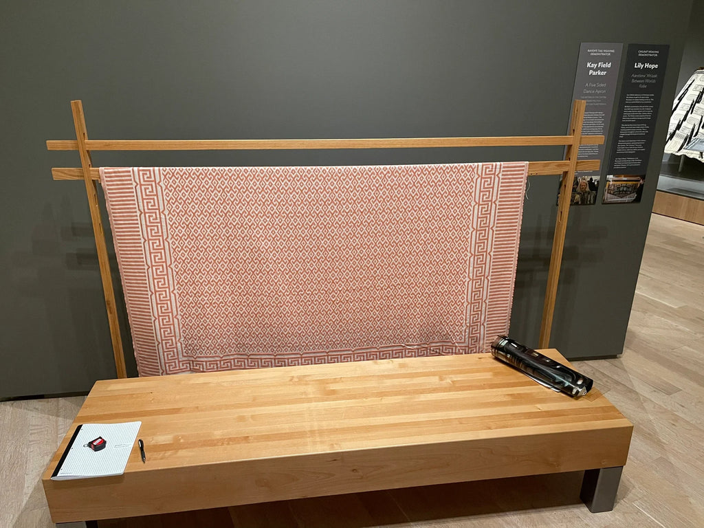 A large wooden weaving loom.