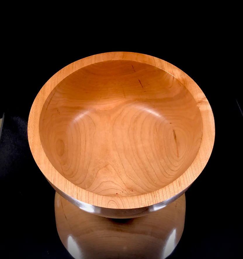 Wooden bowl on a black background