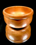 Wooden bowl on a black background