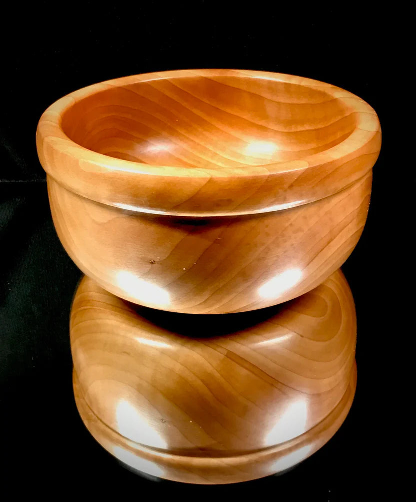 Wooden bowl with a dark background