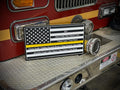 A plaque featuring an American flag and names on the front.