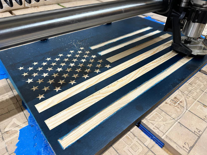 Metal cutting machine with an American flag design on a blue surface