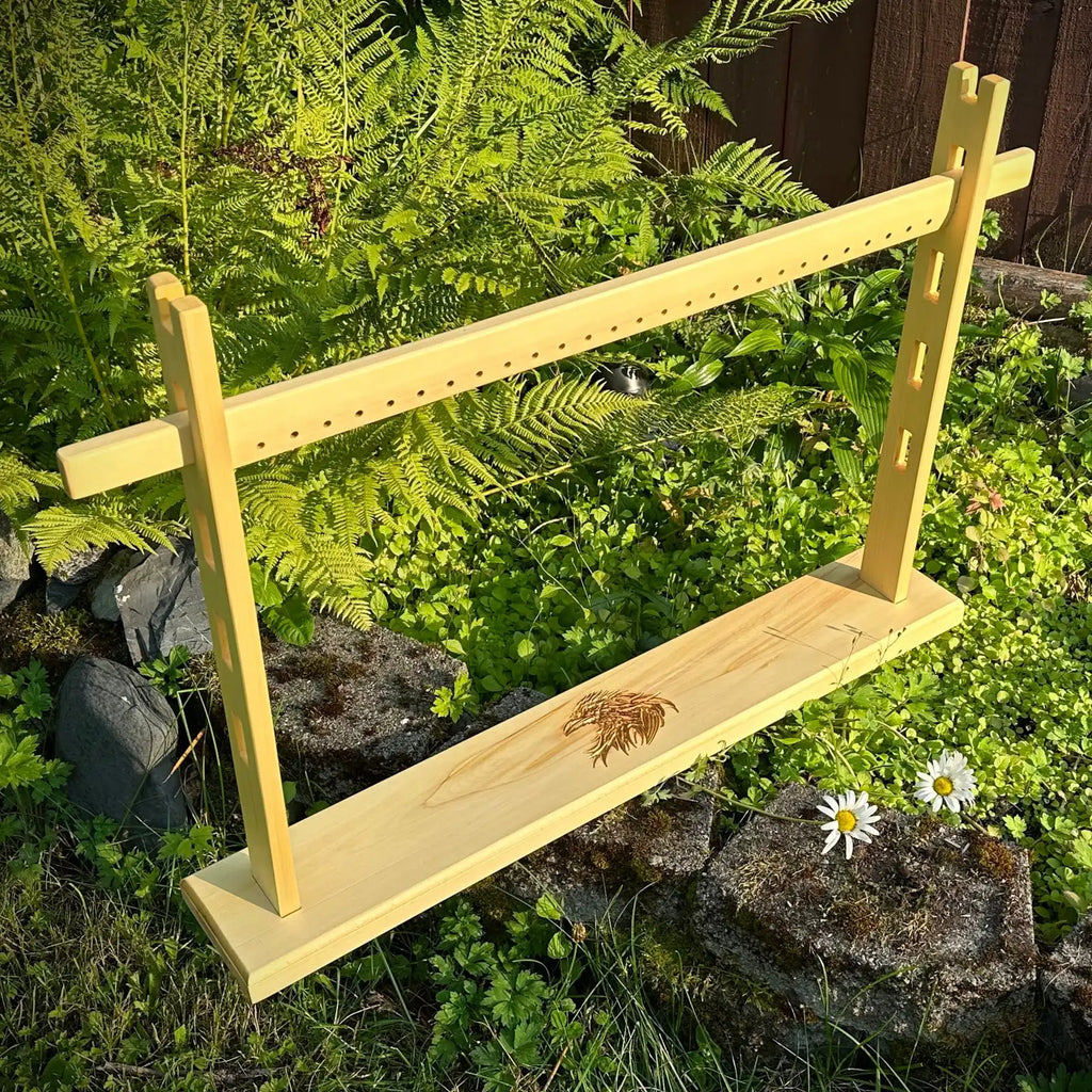 A tabletop weaving loom.